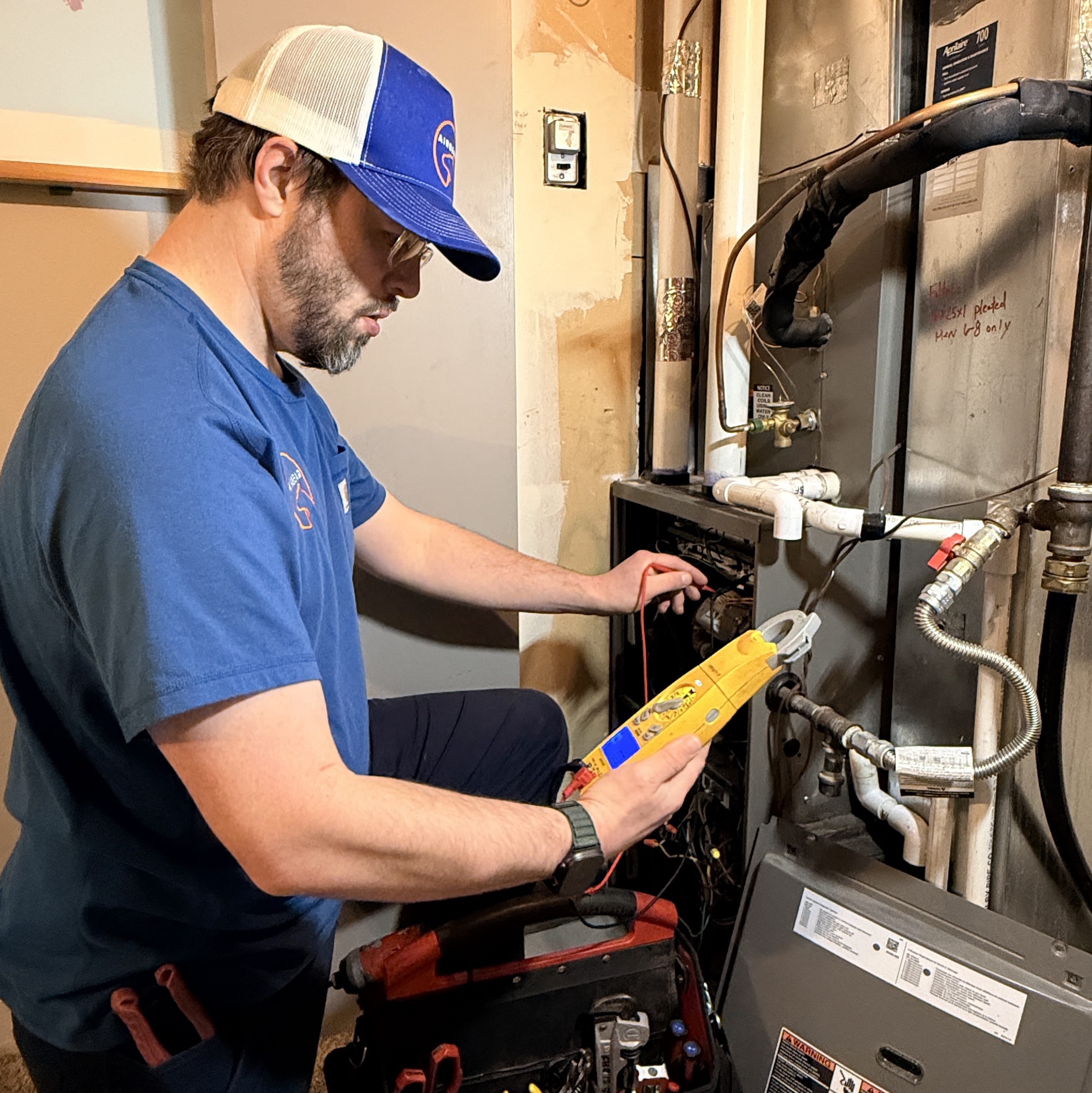 AirBear technician working on HVAC equipment